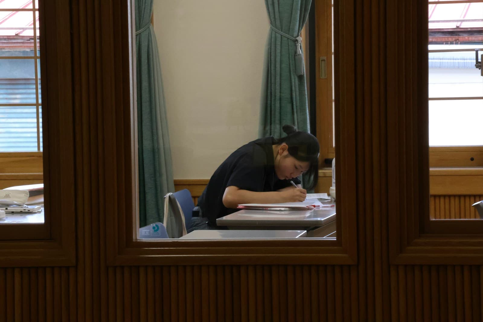 A student writing an examination paper